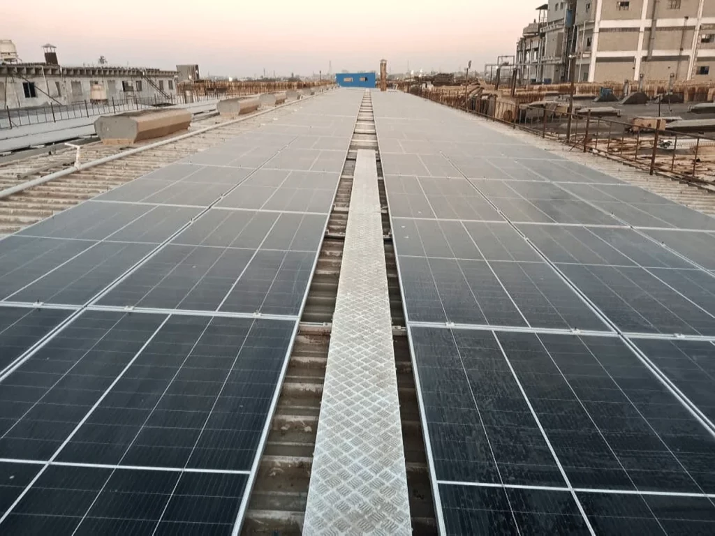 A beautiful sunset peaking through a 495kW solar system installed in Karachi